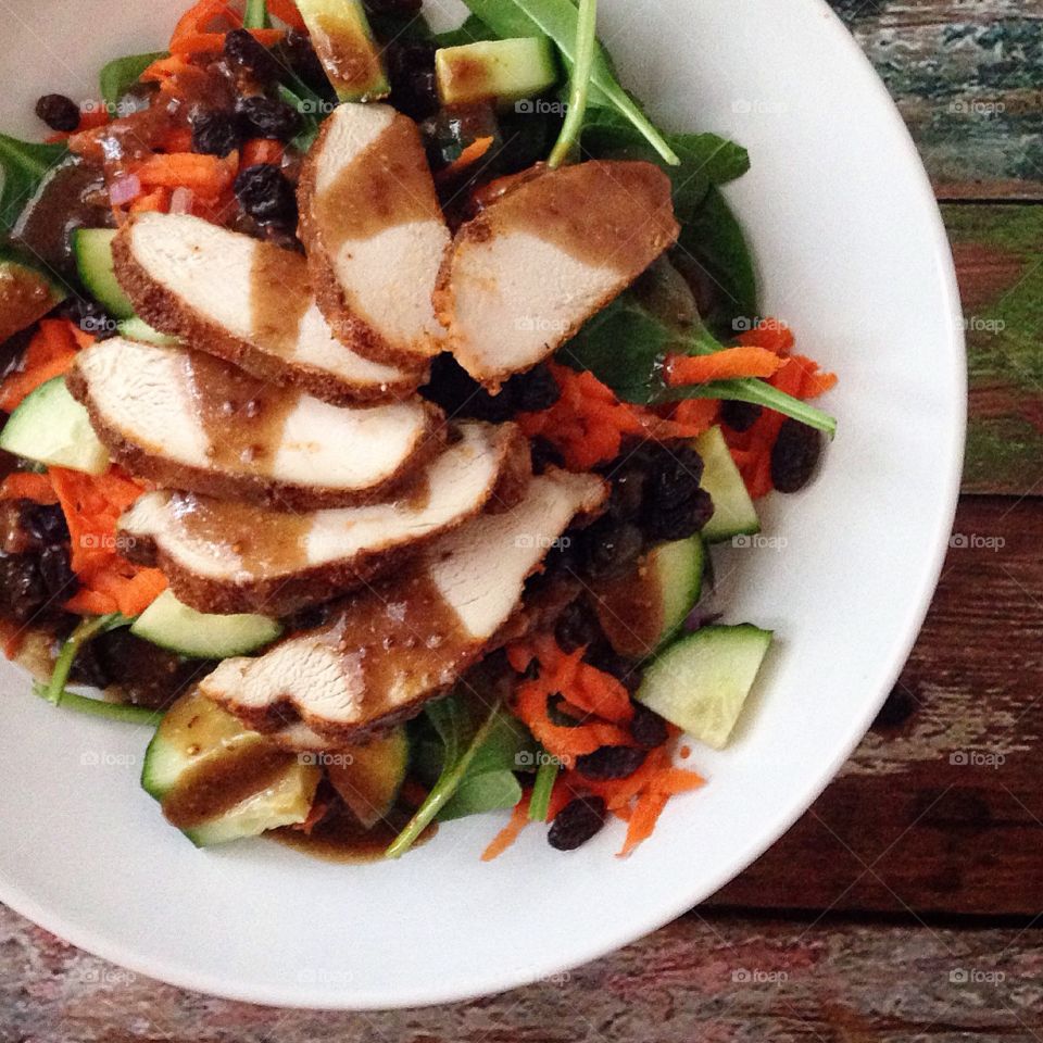 Roasted Chicken Salad. Roasted chicken, spinach, carrots, cucumbers, raisins, homemade balsamic vinaigrette 