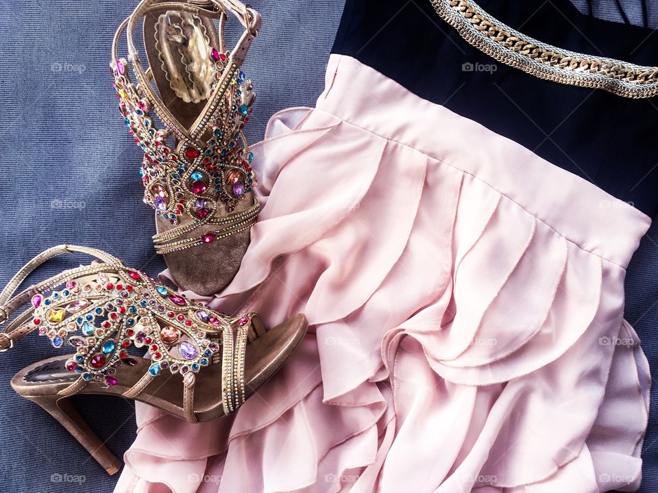 Close-up of sandals with party dress