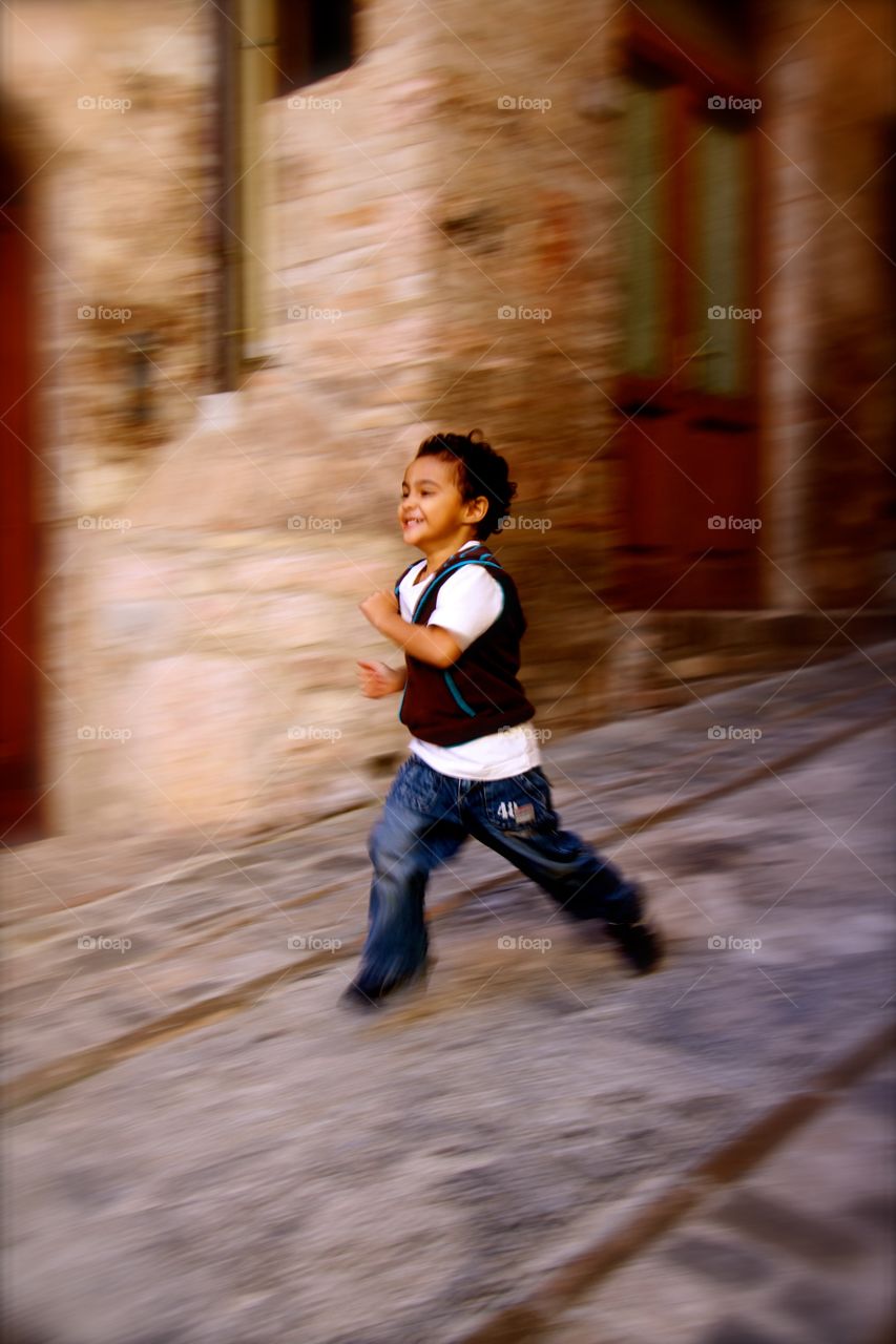 Boy running on the street