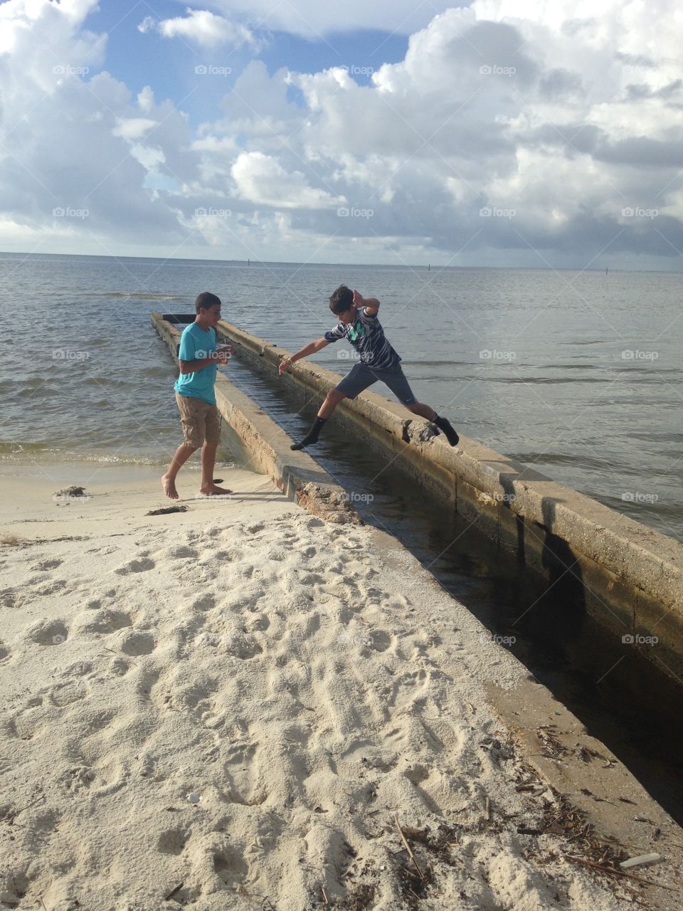 Two boys enjoying at beach