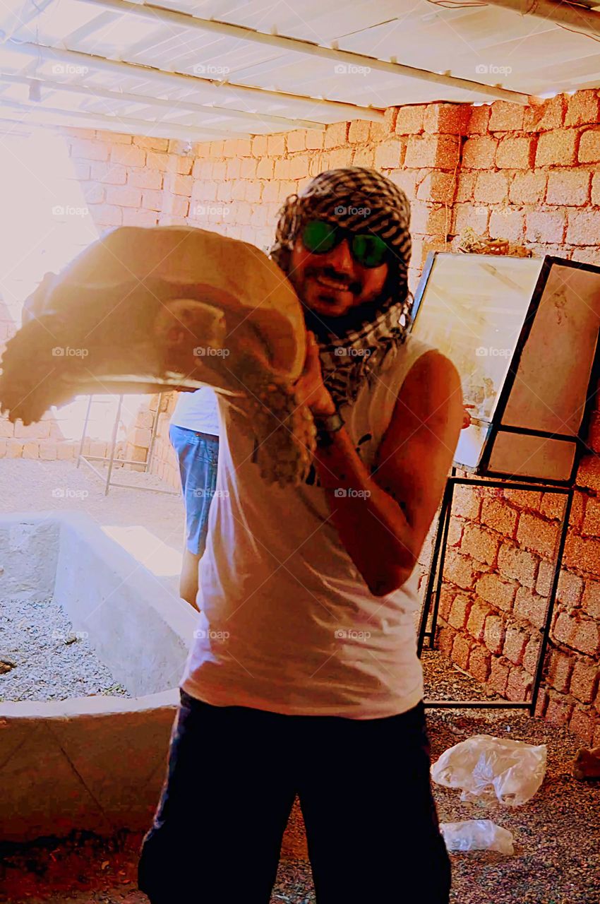 A man carrying a Turtle . 