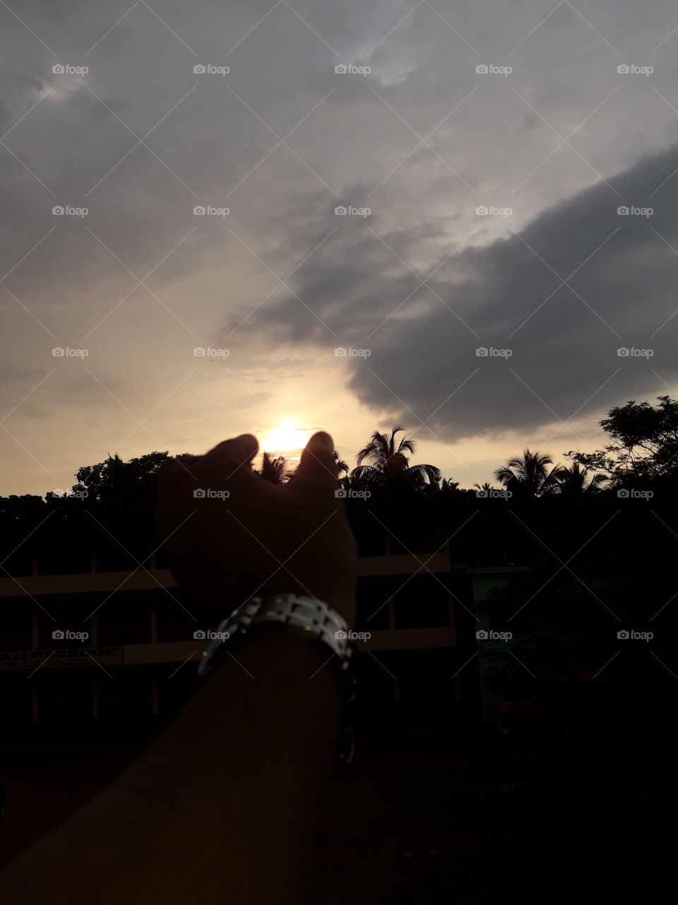 don't judge the people from away. Because,  which is seen, don't be real like this sun. we think that we can take it between our thumb and forefinger because it seen very small from away, But in real, it is very huge.
