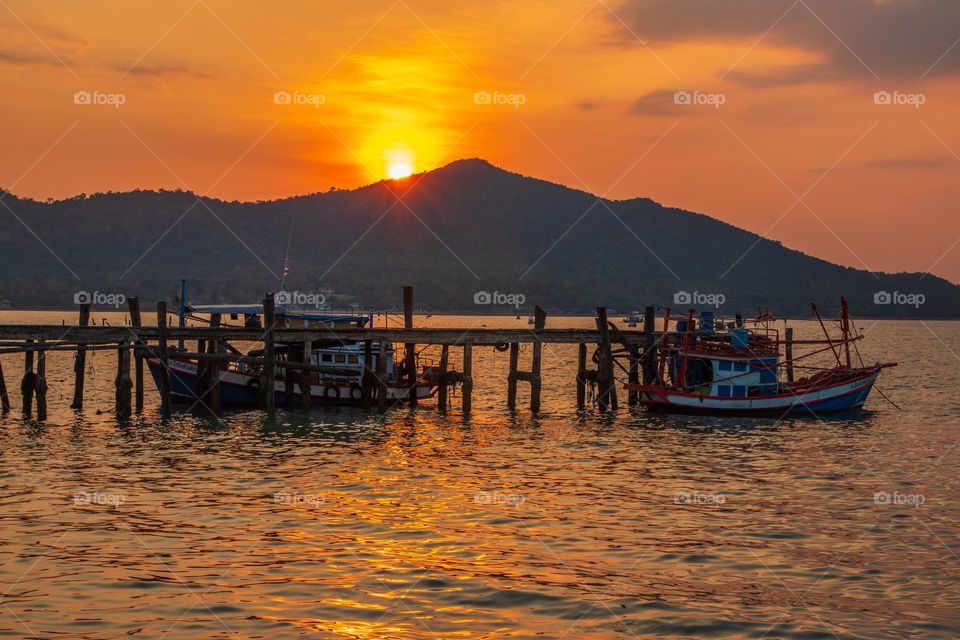 Thai Fisherman's Boats at a Fishing Pier in Bangsaray District Chonburi Thailand Southeast Asia during the Sunset Timeline