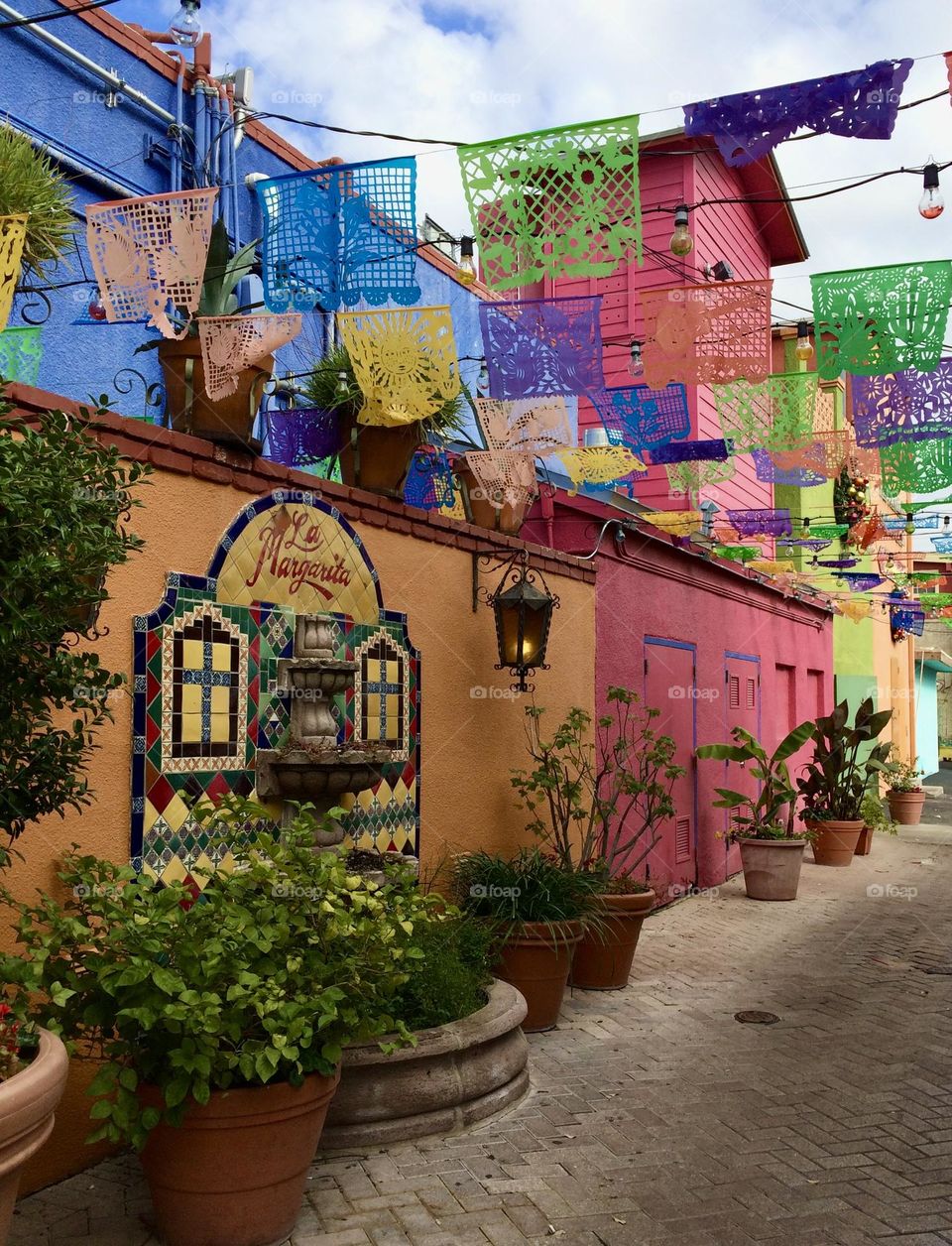 Colorful buildings and papel picado 