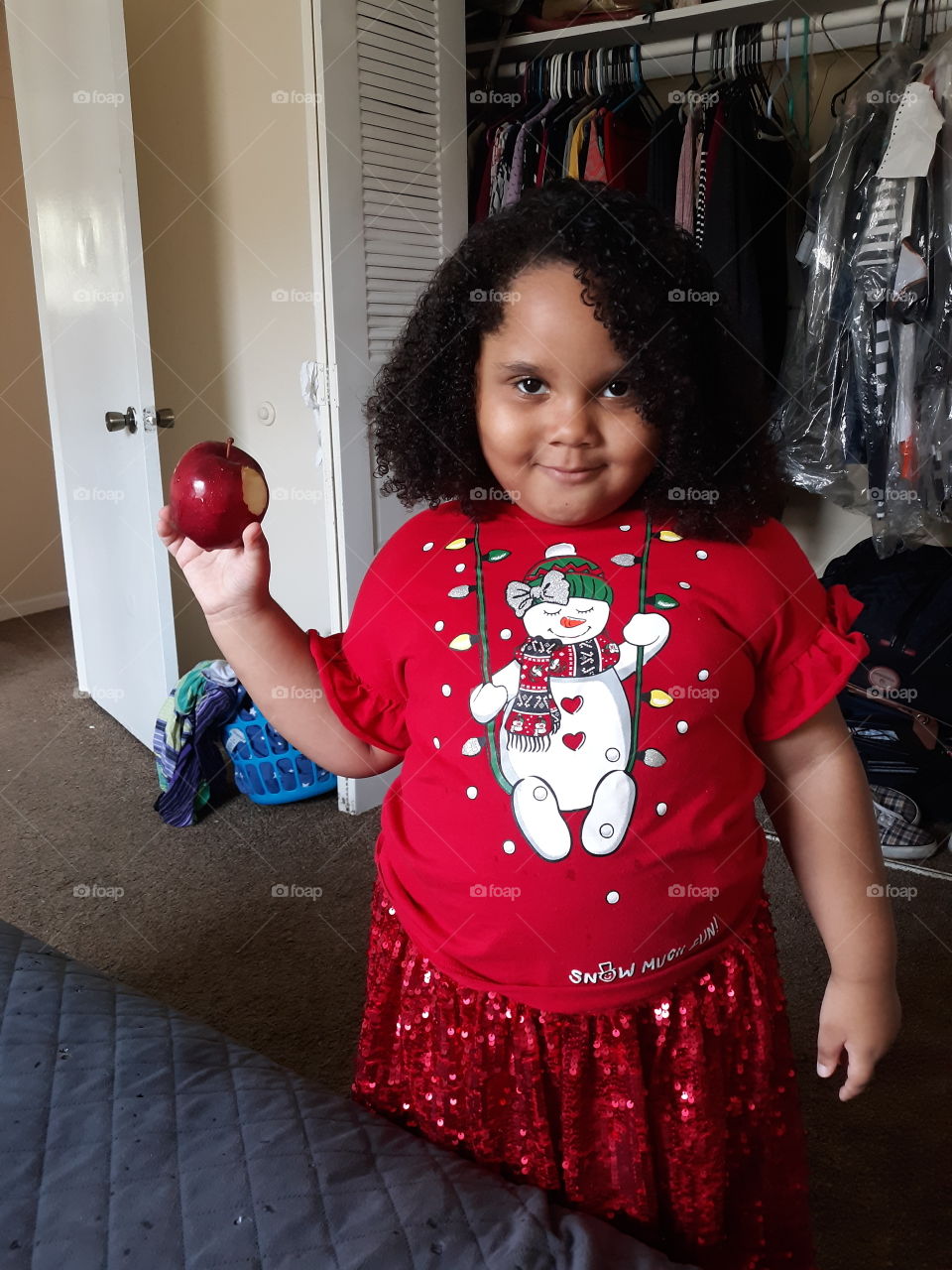 daughter with apple at Christmas