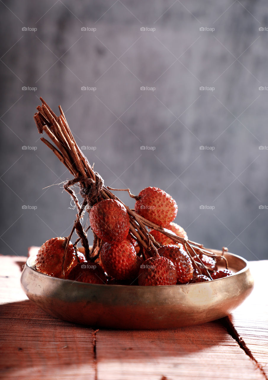 Indian fruit lychee in a metal bowl