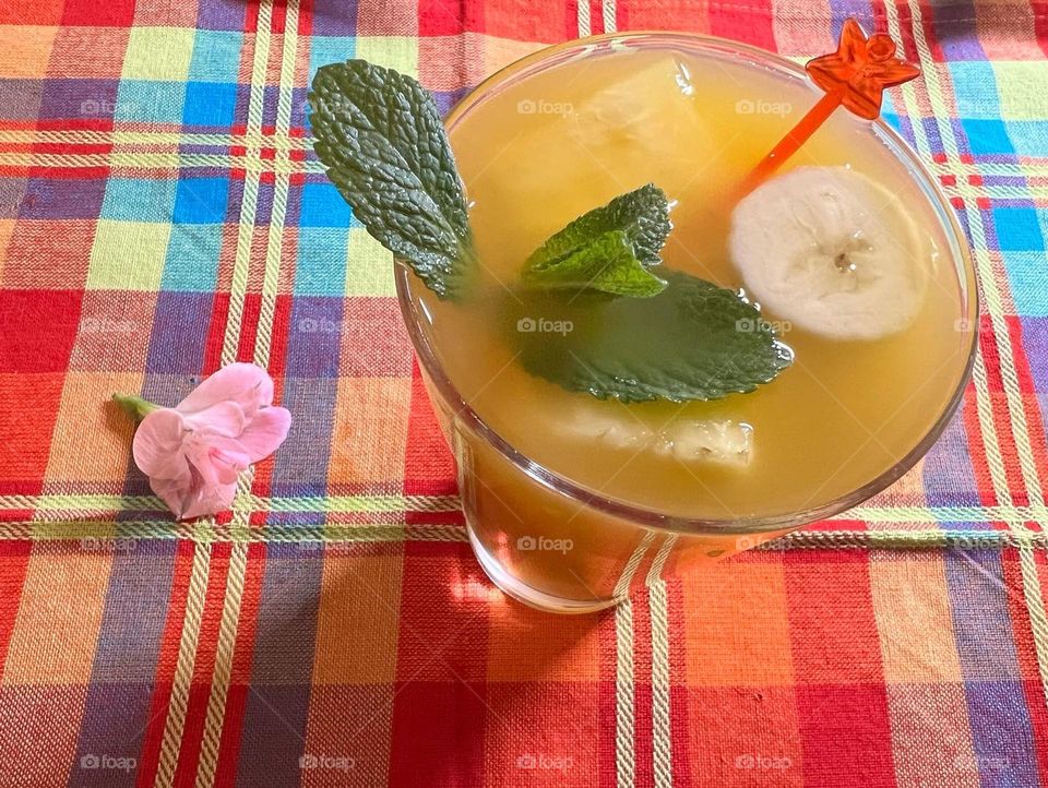 Homemade Brazilian cocktail with flower decoration.