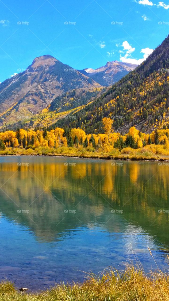 Placid fall splendor reflected on a high mountain lake.