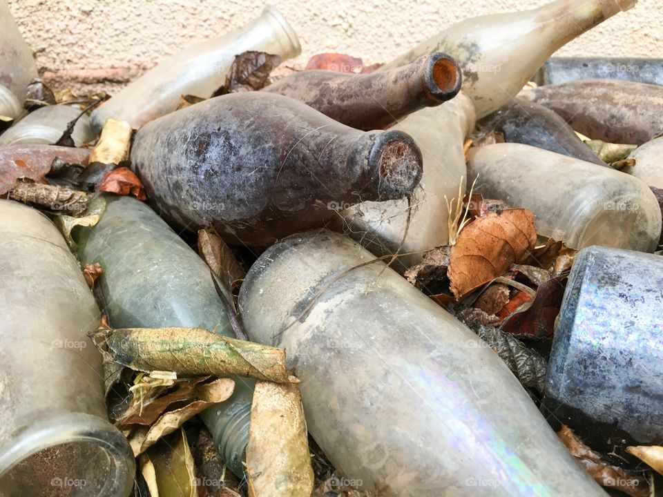 Pile old vintage antique dirty grungy bottles 