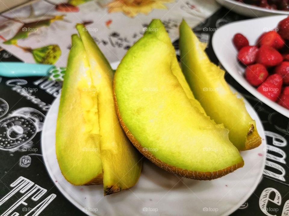 Fruits berry view bio fresh yummy healthy Red strawberry view table day part yellow melon day part