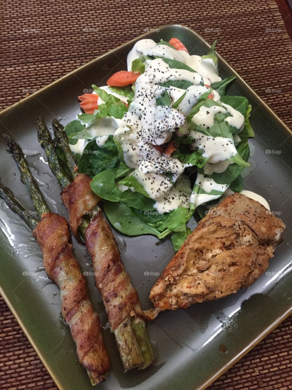 Grilled chicken with bacon wrapped asparagus and salad