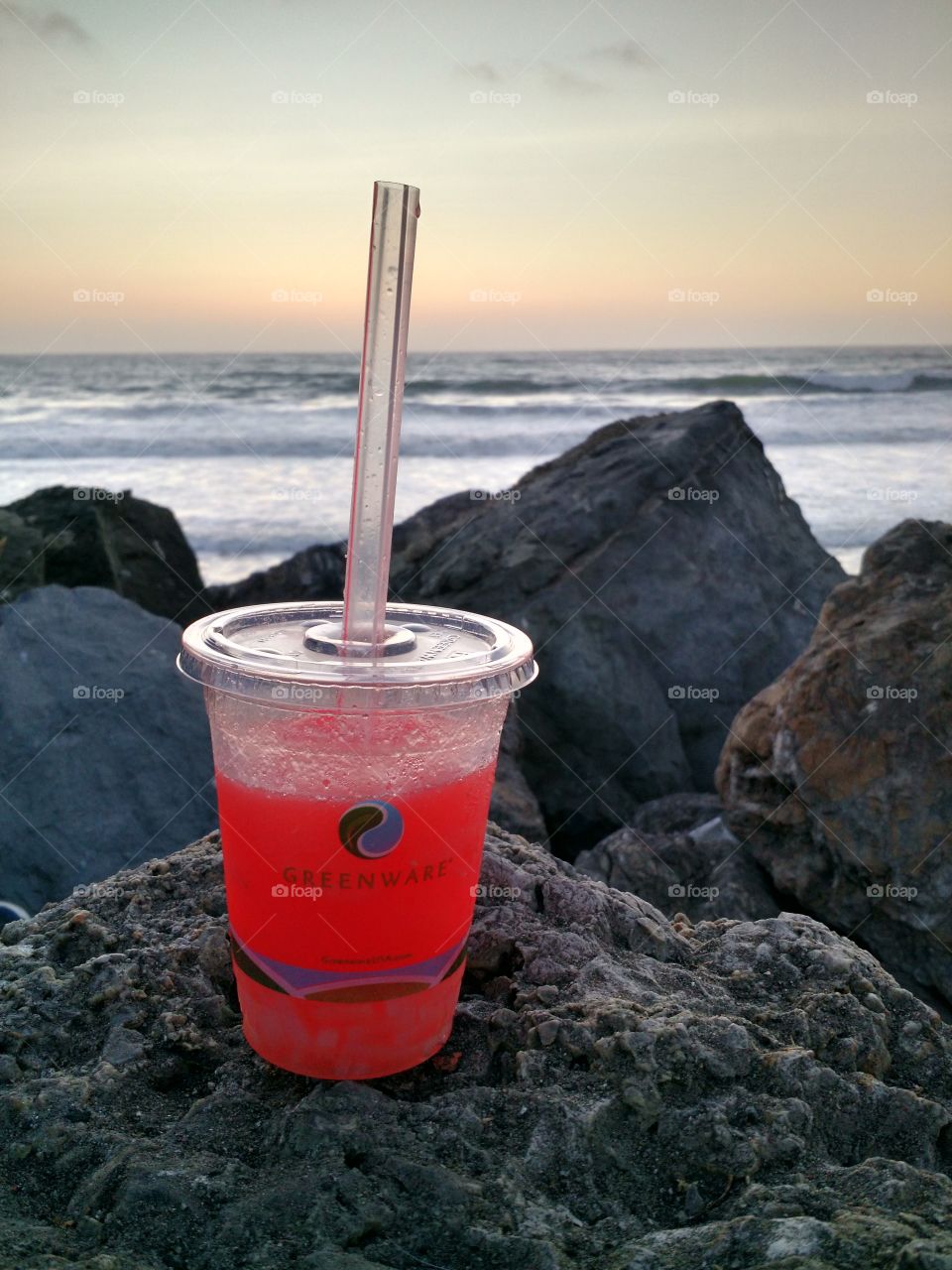 drink enjoys a sunset. Pacificia, CA.