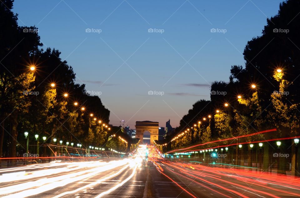 Traffic flying around the Arc de Triumph in Paris