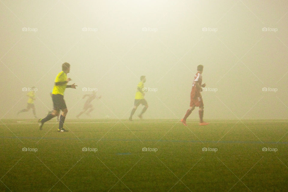 Soccer game in fog
