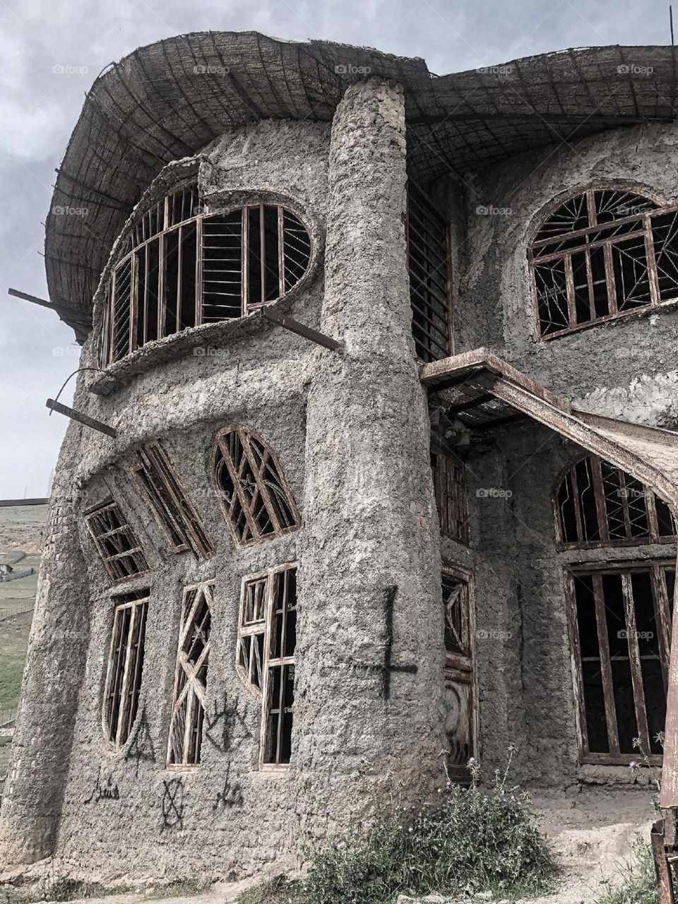 An artist villager who had a  little money has  built this strange and beautiful house with his own design