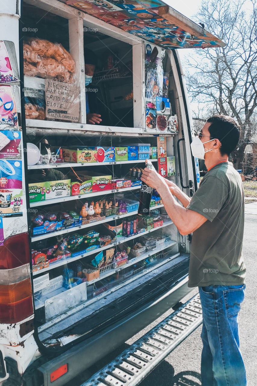 Man buying a bottle of Coca-Cola from the ice-cream truck during the 2021 pandemic.  no. 2