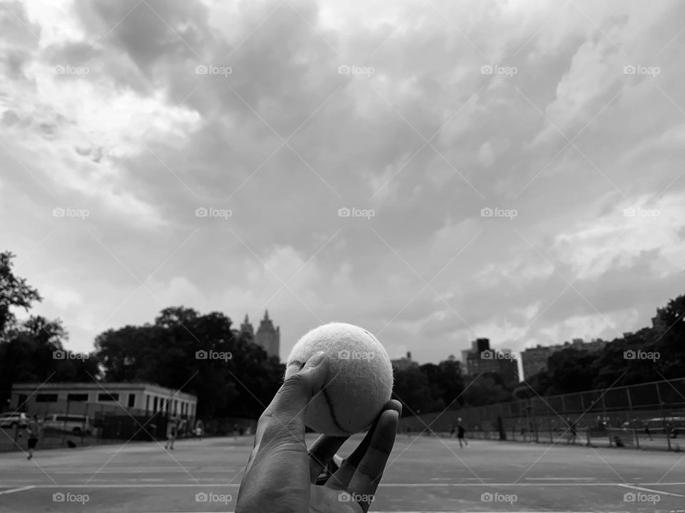 Enjoying the summer by playing tennis at Central Park New York. 