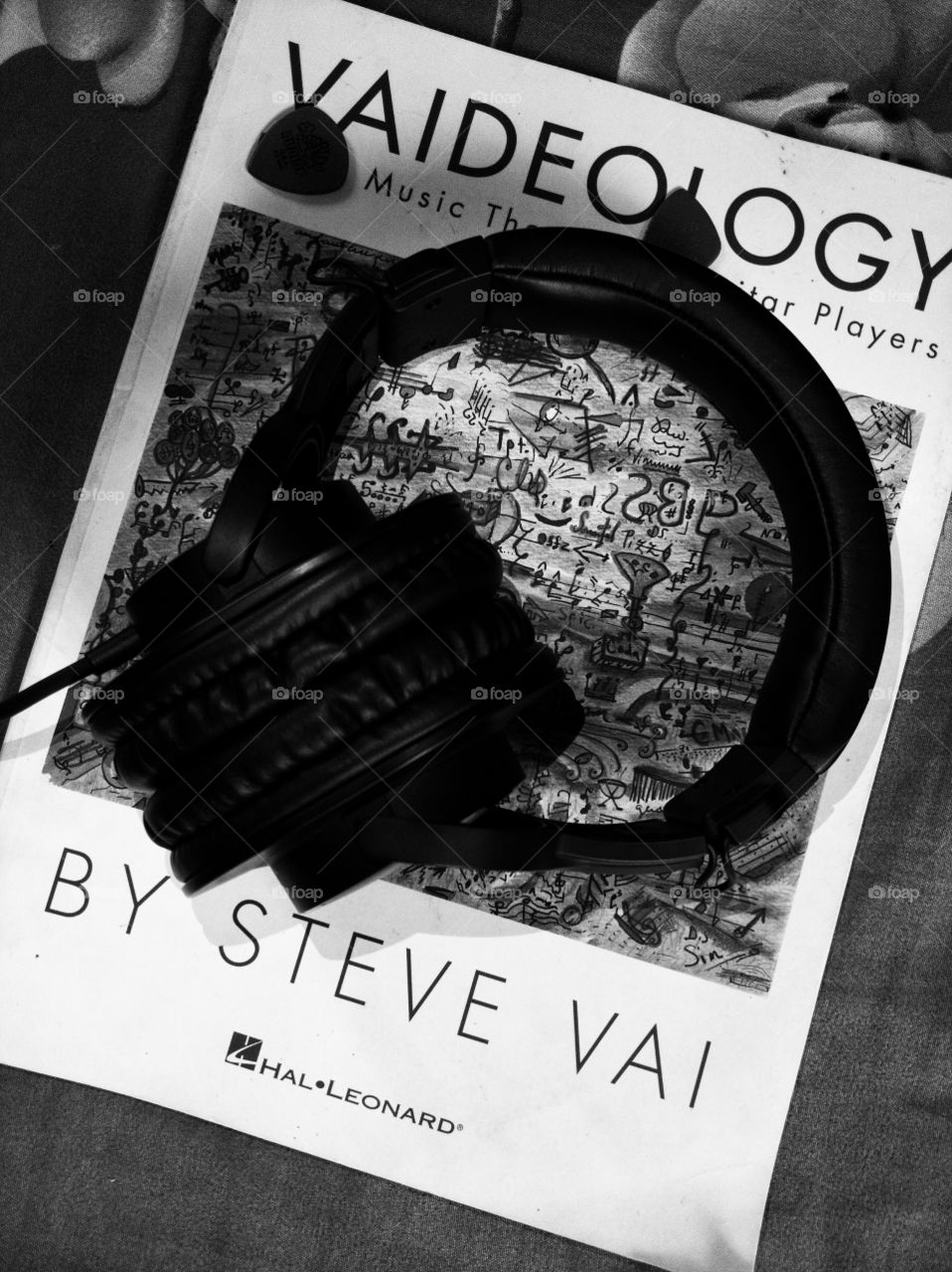 music theory book and headphone