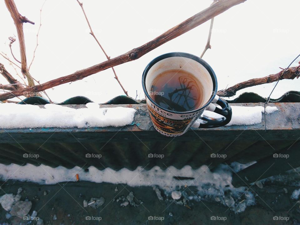 A cup of hot tea in winter