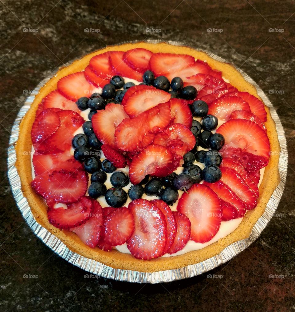 Homemade cheesecake with fresh strawberries and blueberries for the 4th of July!