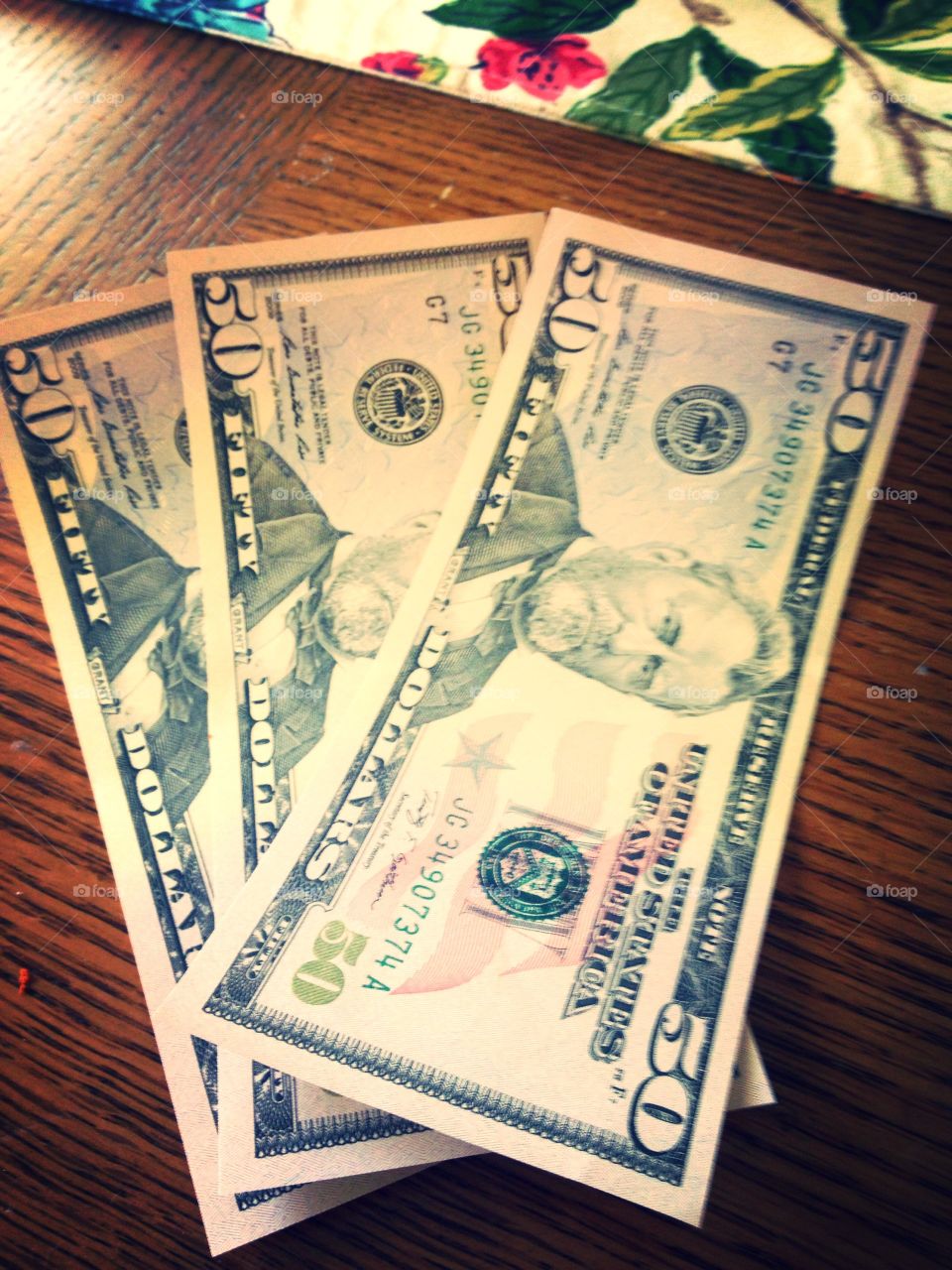 Three $50 bills