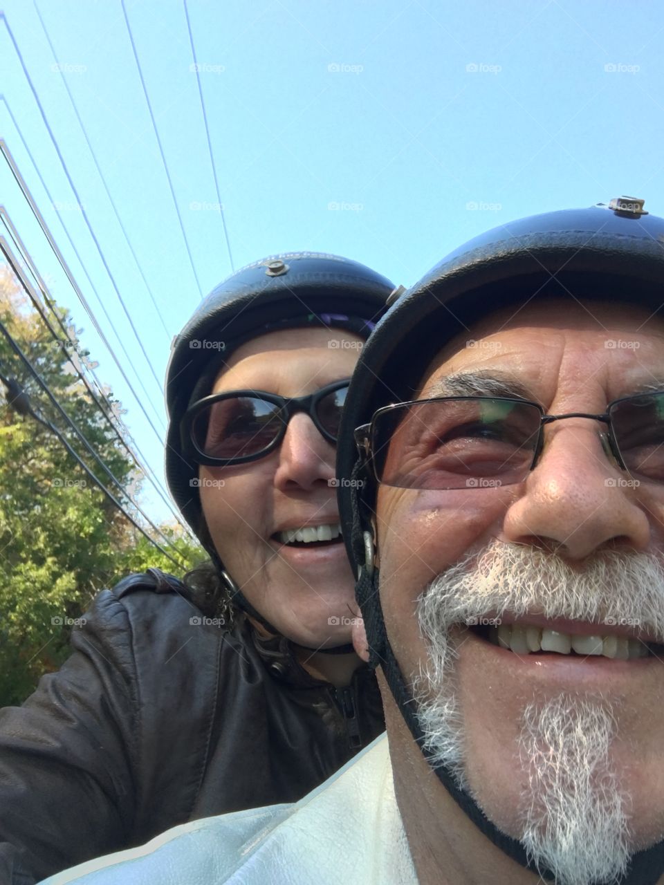 Senior couple riding on bike