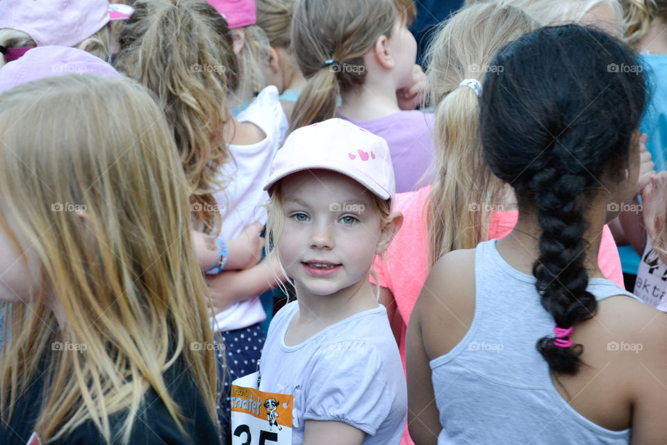 Close-up of a girl wearing a cap with heart shape