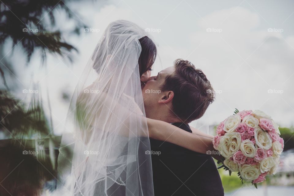 A couple sharing a loving kiss