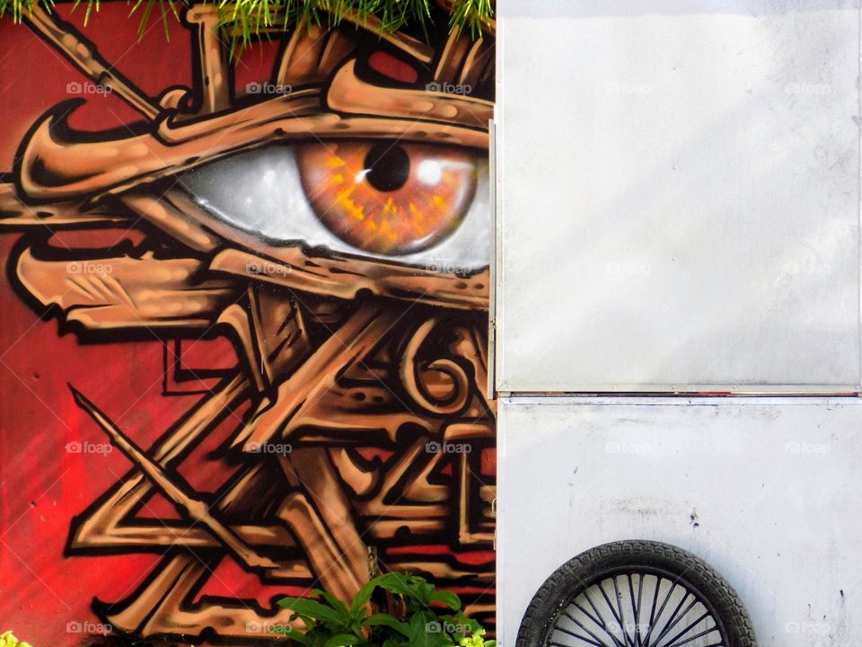 Cart in front of the city mural