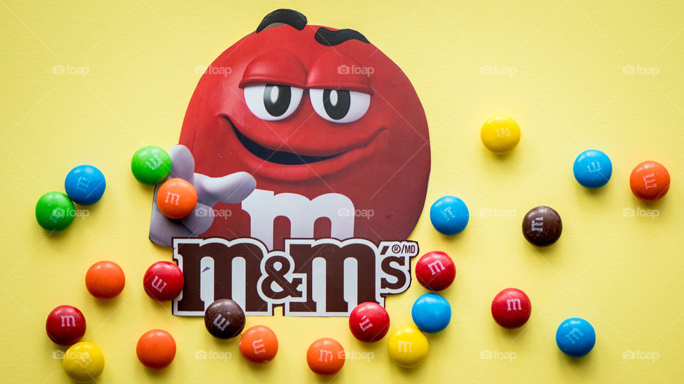 M&M's mascot on yellow background