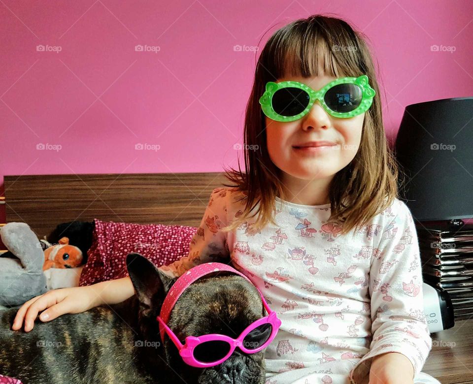 Girl and dog wearing goggle
