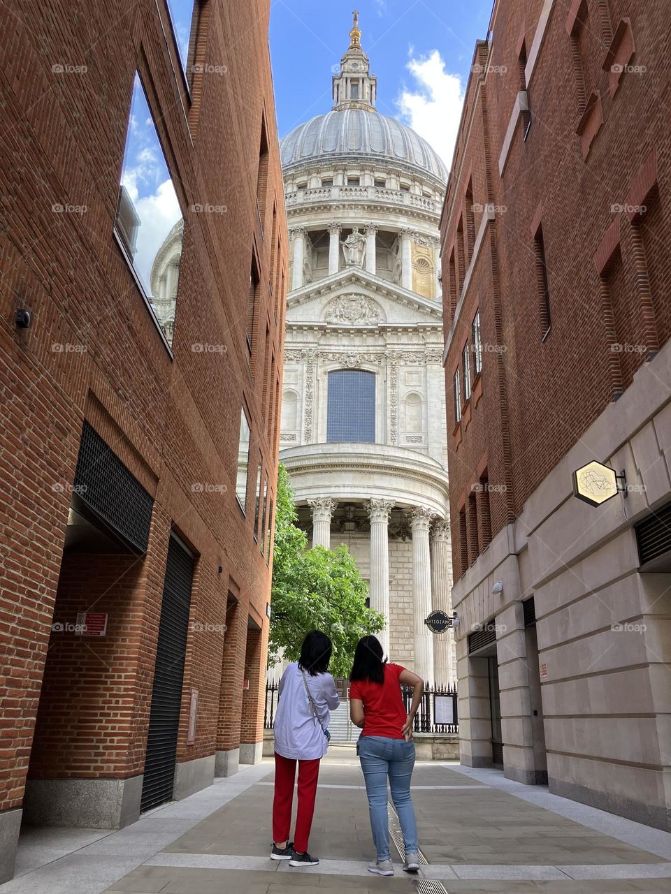 Hot in the city … two young people admiring St Paul’s cathedral in the shade 