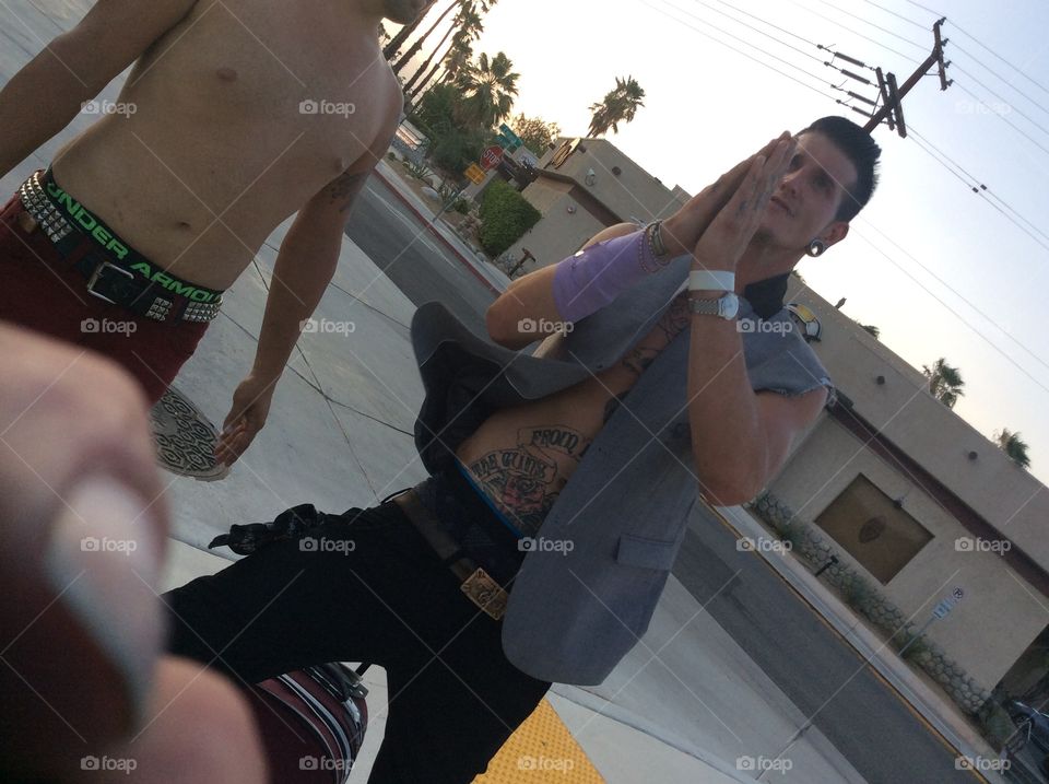 Man praying with tattoos in Palm Springs
