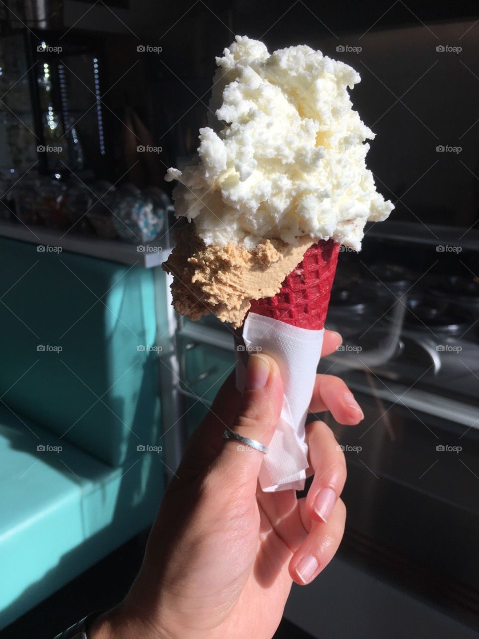 Hand holding bright ice-cream