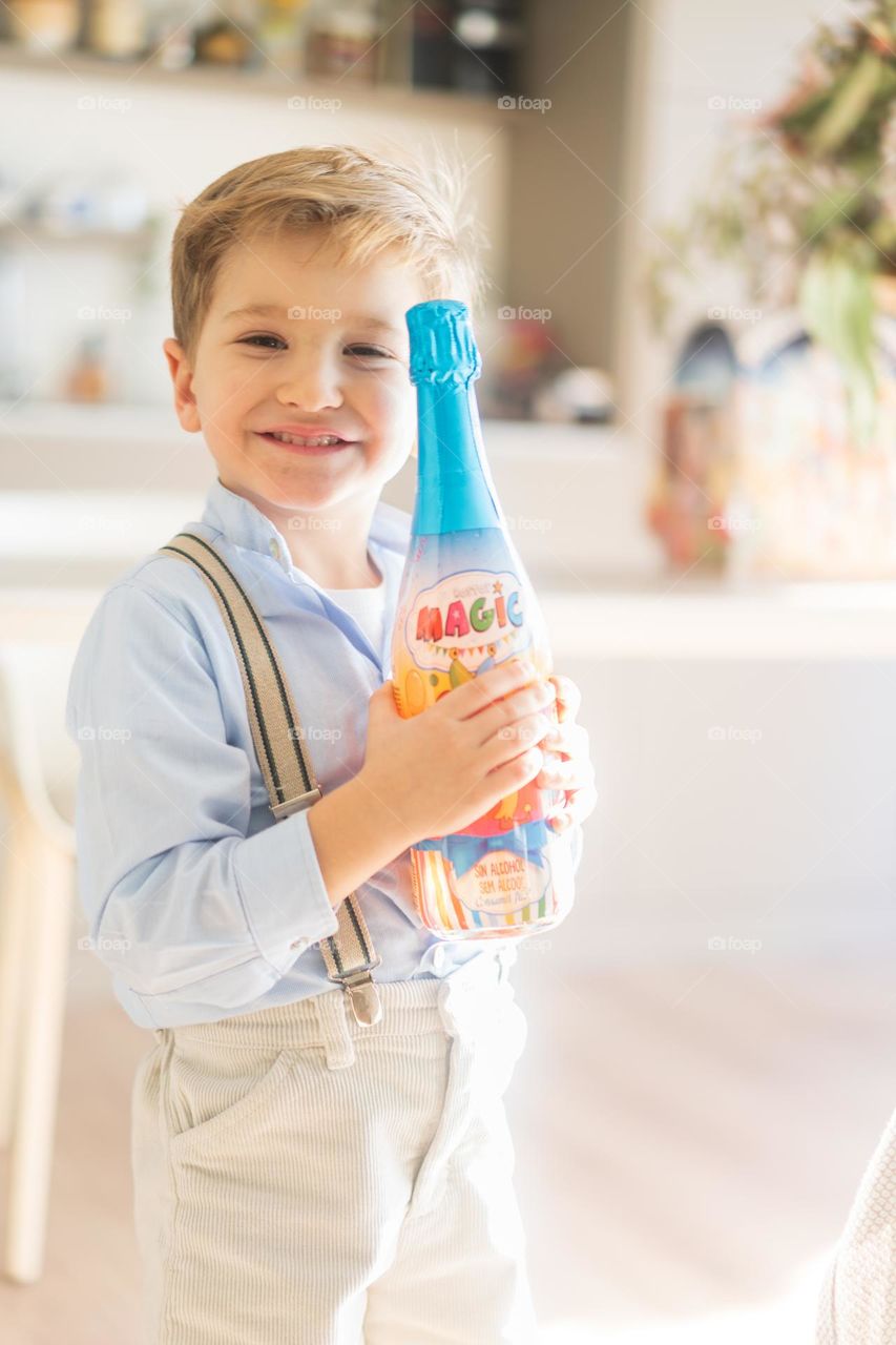 Superexposed Kid with Sparkle Sidra without alcohol bottle. 