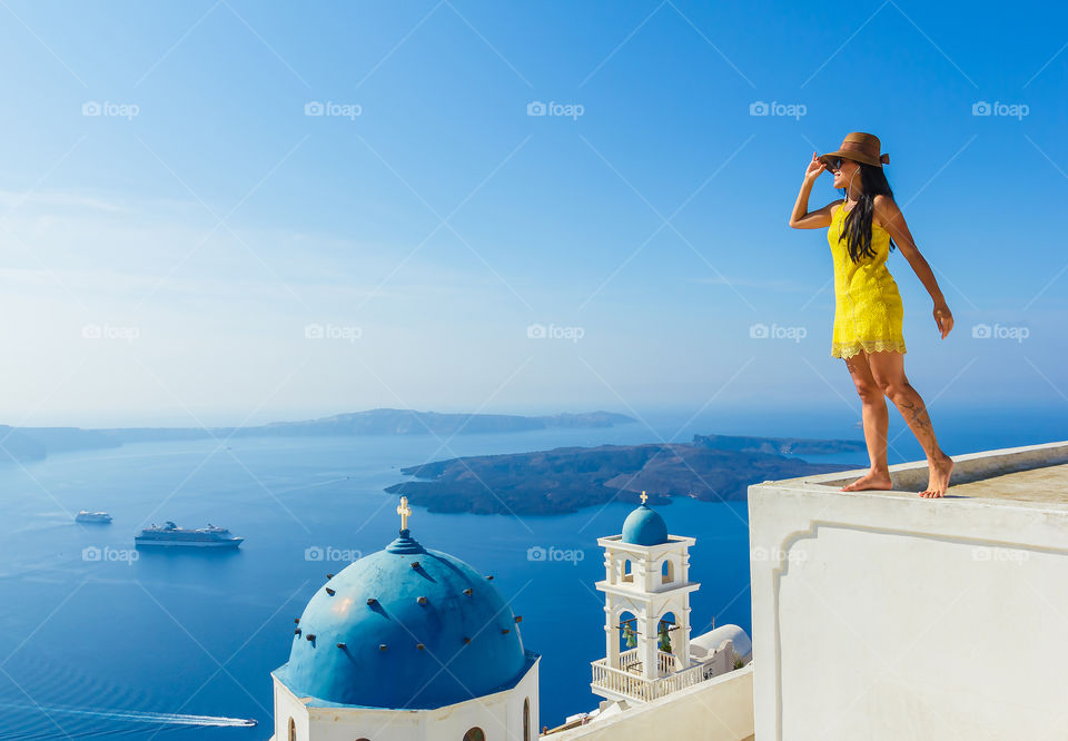 Female tourist enjoying at Santorini with beautiful view 