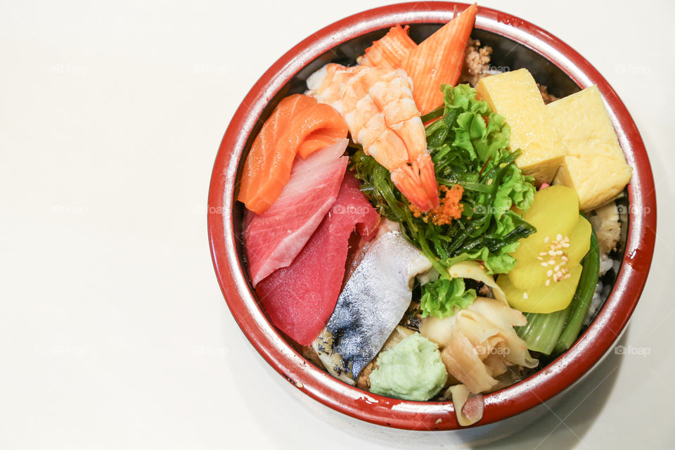 Sashimi in bowl with vegetables