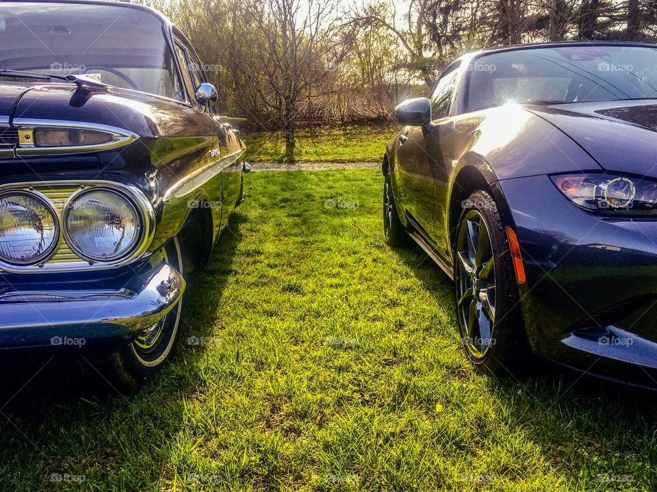 Young vs old, classic vs modern, antique vs sleek. 1959 Chevrolet Bel Air and a Mazda Miata. 