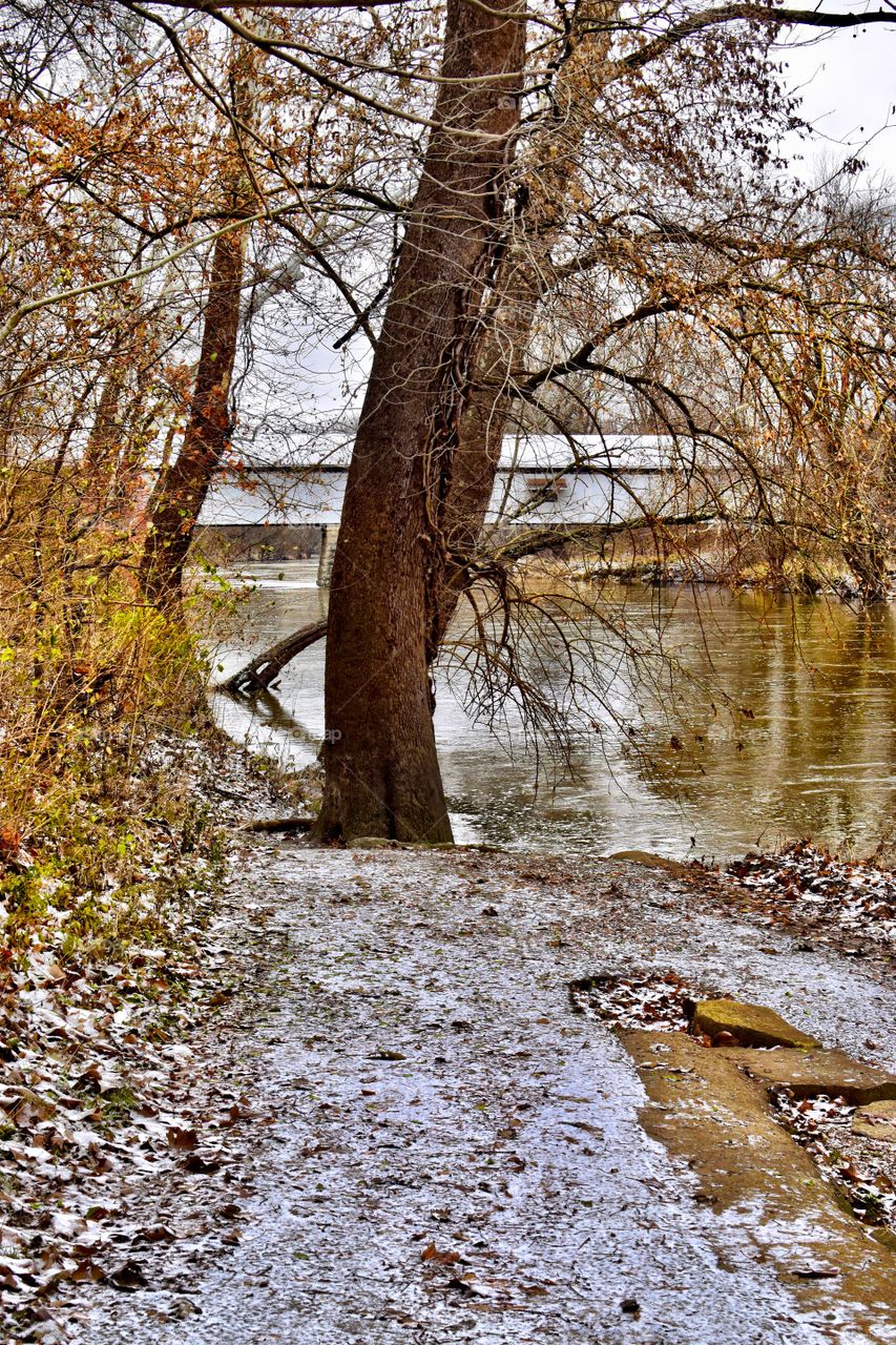 Winter days on the river and the old covered bridge in indiana