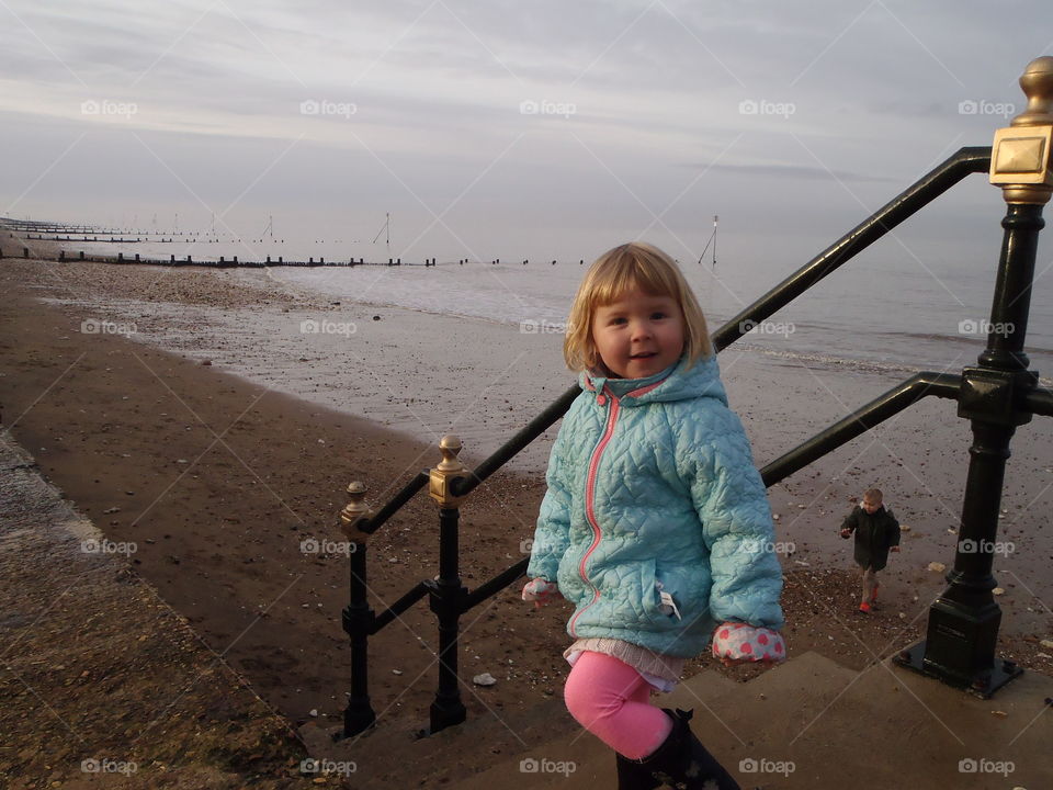 Smiling girl standing on the steps