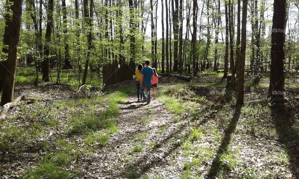 kids walk in the woods 
at town creek indian mound nature trails
