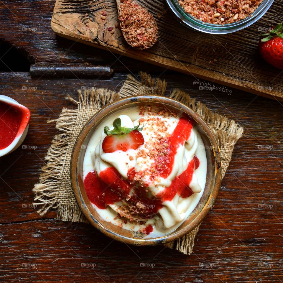 Vegan ice cream with strawberry sauce