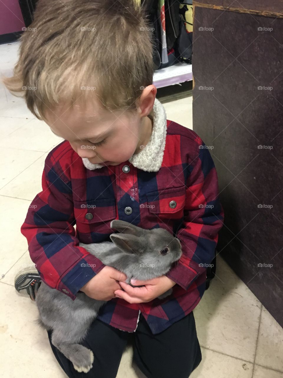 Boy holding a bunny 