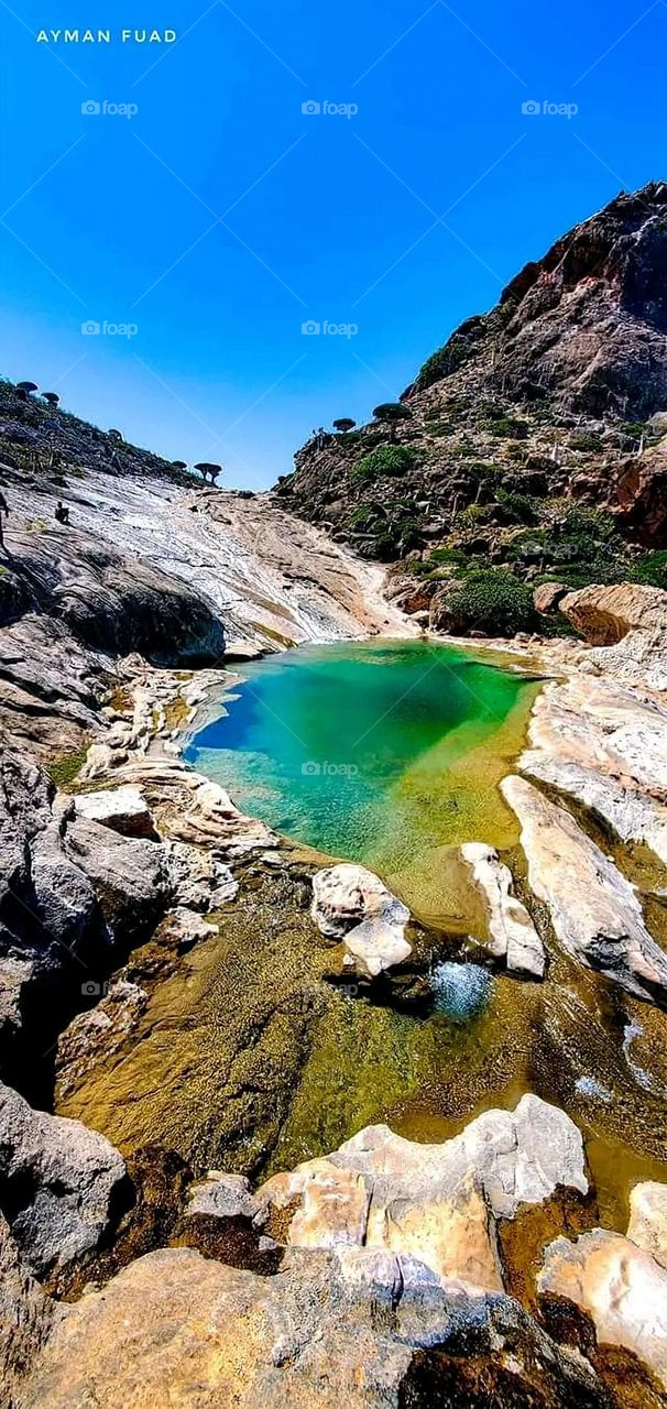 A stunning view of green mountains covered in fog in Yemen