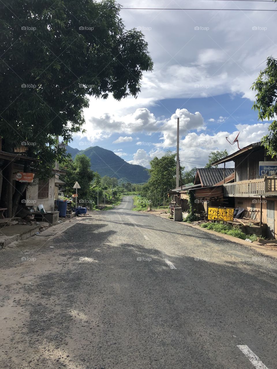 Road leading through a small village to the Pak Ou caves.