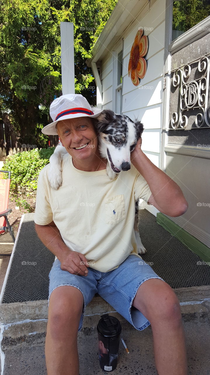 Smiling man with dog