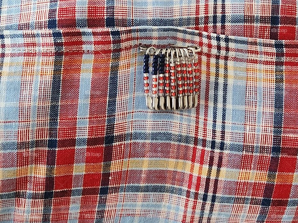 Independence Day (4th of July) craft project: metal safety pin American Flag attached to plaid striped pillow