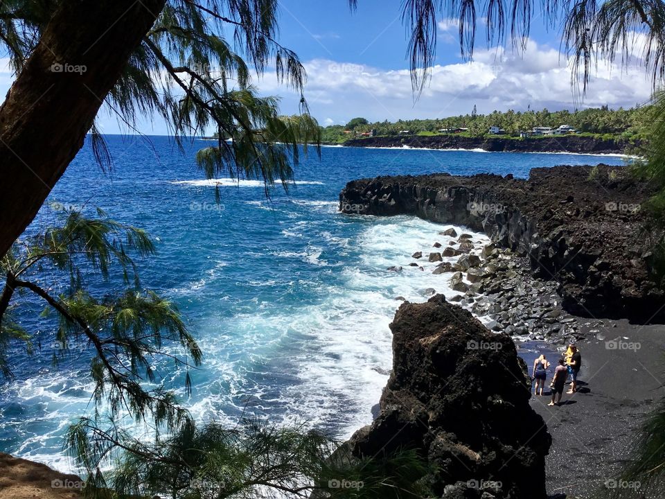 On the black sand beach