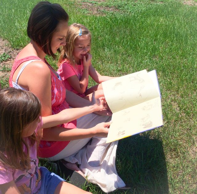 Mother teaching her two daughter