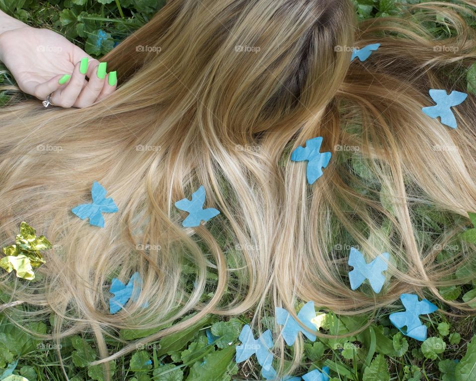 Butterfly Hair, woman laying on the ground
